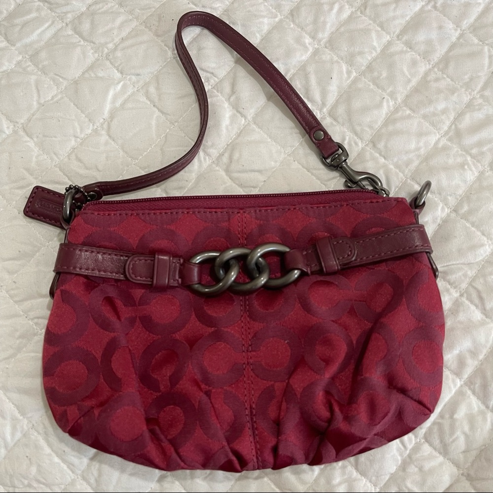 Coach small wristlet bag, Signature C pattern, wine color, never used.